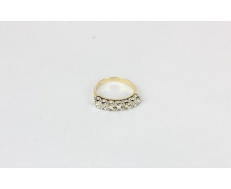 A diamond seven stone half hoop eternity ring in 9ct gold