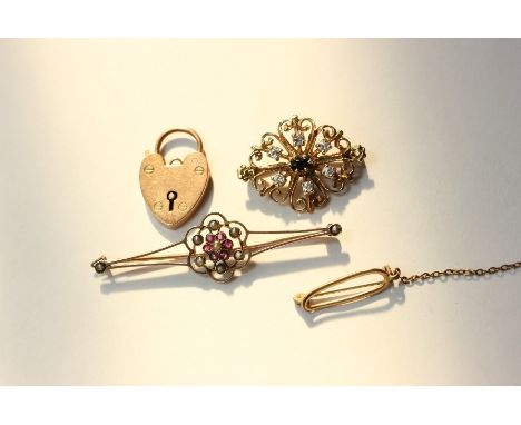 A sapphire and diamond pierced brooch; a seed pearl and gem set bar brooch with padlock clasp