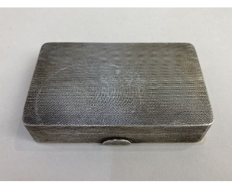 A George VI rectangular silver snuff box engine turned London 1935, 4oz, 8.5cm