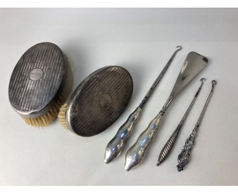 A pair of George V silver backed clothes brushes, maker Levi &amp; Salaman, Birmingham 1925, (a/f bristles) a pair of silver 