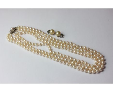 A two row cultured pearl necklace on a 9ct white gold and diamond clasp; a pair of imitation pearl earclips