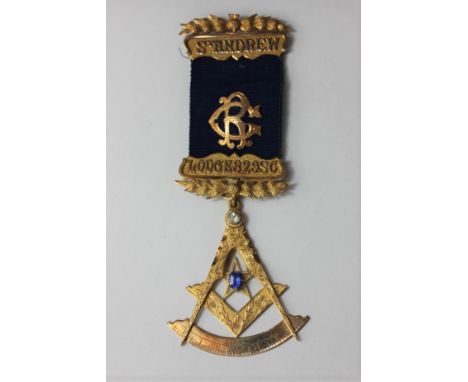 A 15ct gold Masonic jewel set with two gems; unmarked stick pin on bar engraved Lodge 82980; blue ribbon with gold monogram 3