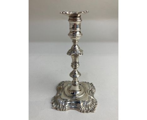 A George II silver taper stick, maker John Cafe, London 1752, crested and monogrammed, sconce unmarked, 13cm high 5.1oz 