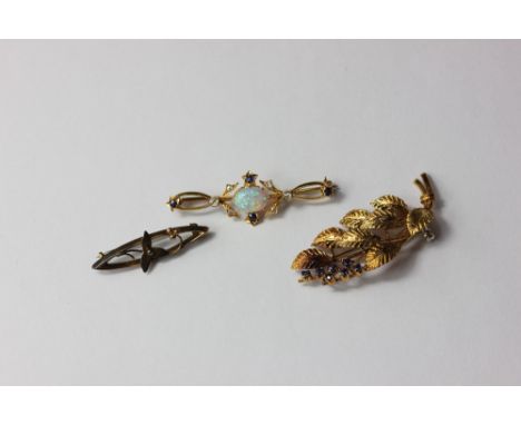 An 18ct gold and sapphire leaf brooch, an opal, diamond and sapphire bar brooch and a small 9ct gold brooch