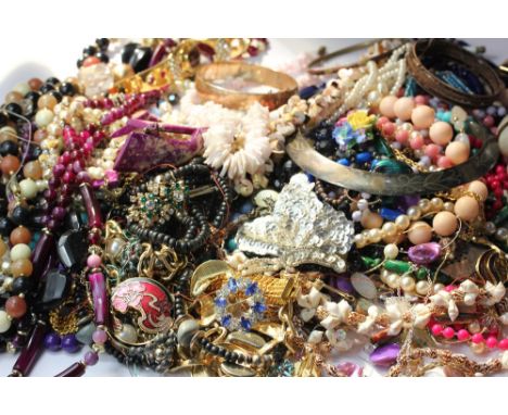 A quantity of costume jewellery to include a rolled gold bangle and a 22ct gold plated ingot pendant