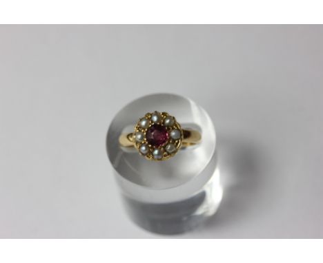 A tourmaline and pearl cluster ring in 18ct gold