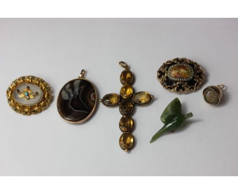 A citrine cross pendant; a banded agate pendant in gold mount; a gem set chalcedony brooch in pierced oval mount; a gold and 