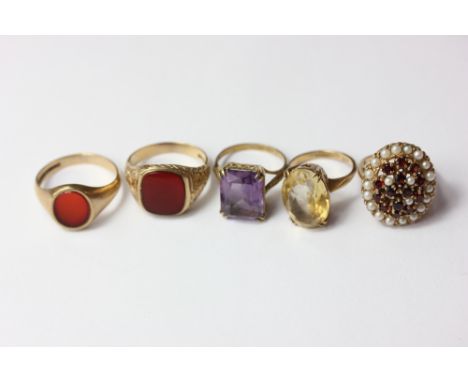 A garnet and seed pearl dress ring; an amethyst ring; a citrine ring; two hardstone set signet rings; all in 9ct gold