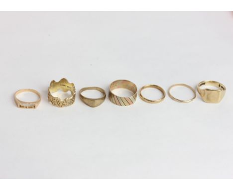 A 9ct three colour gold ring and five other 9ct gold rings 21 g