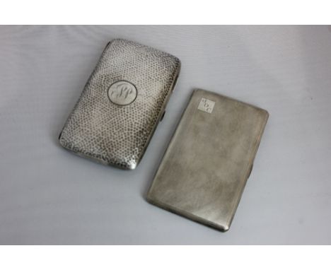 An Edward VII silver cigar case rectangular shape with hammered decoration and plain circular centre with engraved initials, 