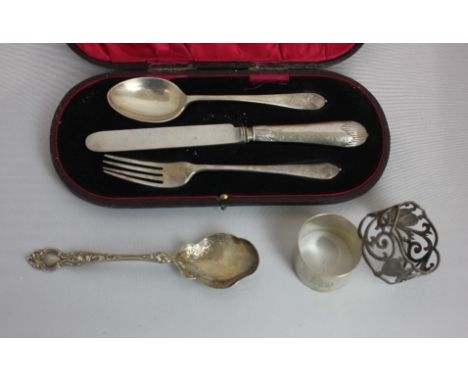 A cased George V silver christening set of spoon, knife (a/f) and fork, engraved with the Royal Flying Corps wings and name, 