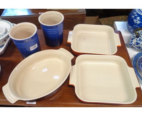 Five pieces of Le Creuset ceramics comprising three roasting dishes and two utensil holders