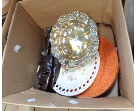 A box containing a quantity of collectable items including African carved hardwood wall masks, lace place mats, Carltonware d