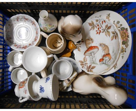 A crate containing a quantity of ceramic items including Brambly Hedge, Szeiler dogs, etc.