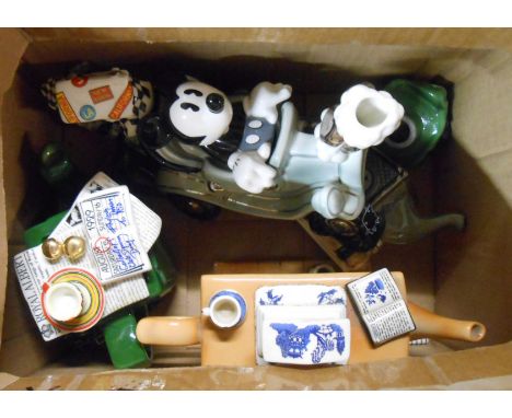 A box containing a quantity of ceramic novelty teapots including Micky Mouse motor car, Cardew Designs fireplace, etc.
