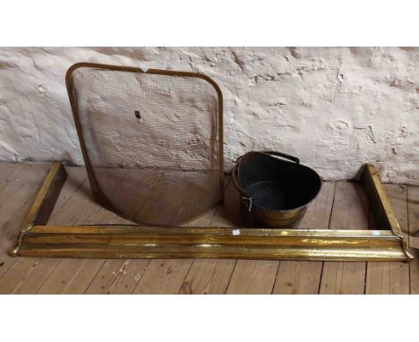 A brass coal bucket - sold with a brass fire fender and mesh fireguard - various condition