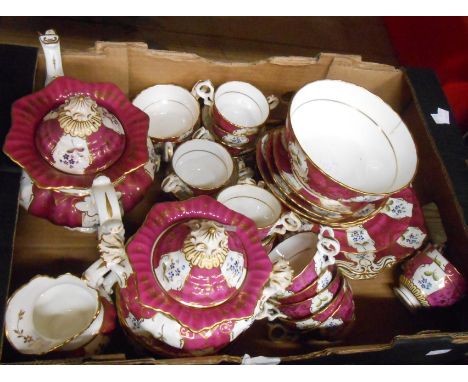 A box containing a large quantity of 19th Century teaware with hand painted floral panels on a purple ground including teapot