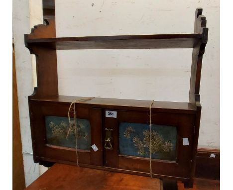 A 60cm Victorian stained pine wall mounted cupboard with shelf over, shaped sides and two doors with painted floral panels