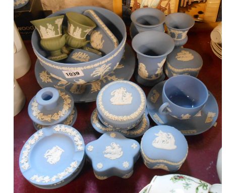 A large quantity of Wedgwood blue Jasperware including trinket boxes, vases, candlesticks, table lighter, etc. - sold with a 