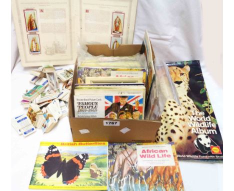 A box containing a collection of albums with cigarette, tea and other trade card contents, other loose cards and small quanti