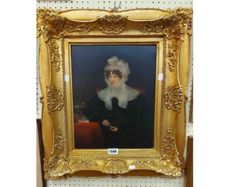 An ornate gilt gesso framed re-lined oil on canvas portrait of a seated lady with lace headdress - 36cm X 30cm