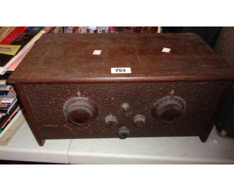 A 1920's/30's Cossor Empire Melody Maker Model 234 valve radio, with wooden case and Bakelite dials