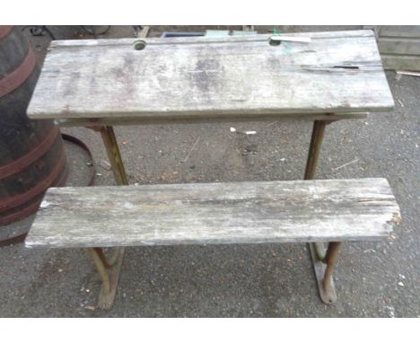 A vintage side-by-side adjustable slope top school desk with solid wooden top and seat, set on cast iron supports - timber a/