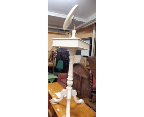 An old nightstand with circular swing mirror, set on turned pillar with tripod base - later white painted finish