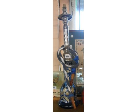A vintage hookah pipe, with blue glass body and metal fittings