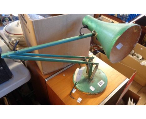 A vintage anglepoise lamp, with later metallic green painted finish, set on circular base