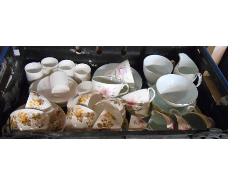 A quantity of Royal Albert teaware in the Elfin pattern including cups and saucers, milk, sugar, etc. - sold with Royal Vale 