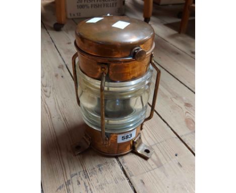 A vintage copper ships lantern with triple mount and glass lens