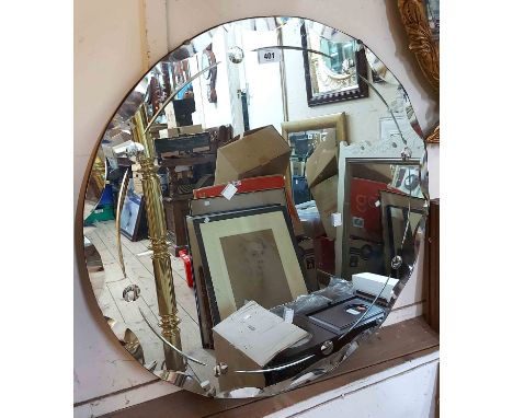 A 68cm diameter vintage frameless wall mirror with cut and bubble line decorated border