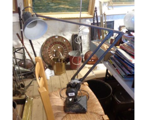 A vintage Admel Fingalite industrial style anglepoise lamp, with counterbalance mechanism, set on square base