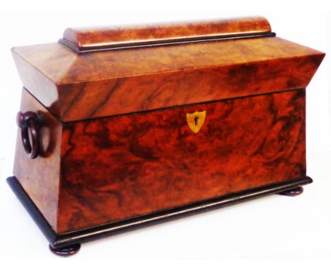 A Victorian walnut sarcophagus form tea caddy with two lift top compartments and glass mixing bowl (a/f)