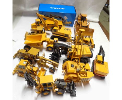 A crate containing a large quantity of model industrial vehicles including diggers, dump truck, boxed Volvo EC210, etc.