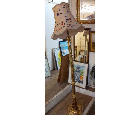A modern brass standard lamp with pillar on stepped square base - shade decorated with applied buttons