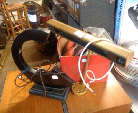 An Art Deco ebonised wood table lamp with C-shaped support and Bakelite fitting - sold with an over picture light