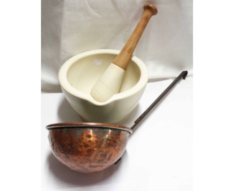 An antique copper ladle - sold with a large ceramic pestle and mortar