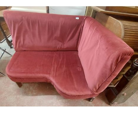 A 1.1m vintage corner seat with red velour upholstery