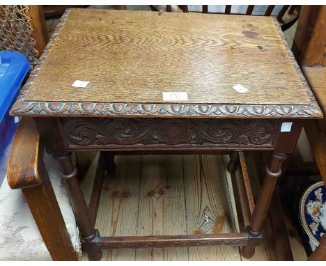 An early 20th Century stained mixed wood framed low elbow chair with rattan back panel and upholstered seat - sold with an oa