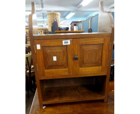 A 44cm vintage oak wall hanging cupboard with shelf to top, pair of panelled doors and shelf under, with shaped sides