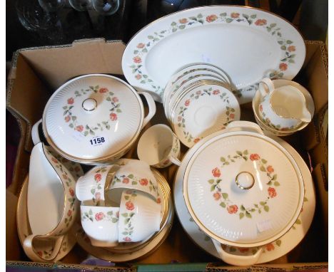 A quantity of Wedgwood bone china tea and dinner ware decorated in the India Rose pattern including vegetable tureens, cups a