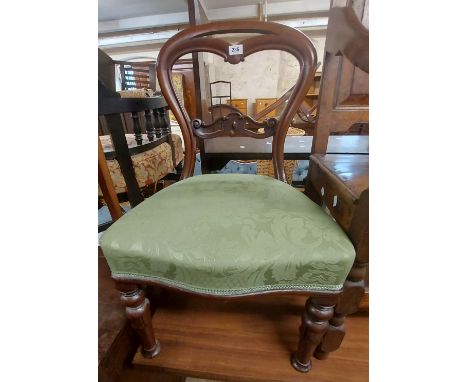 A William IV mahogany framed balloon back dining chair with upholstered seat, set on tulip carved front legs