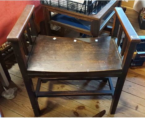 A 60cm old mahogany stool with slatted sides and curved seat, set on square supports and stretchers