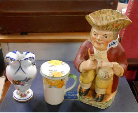 A vintage Toby jug with antique style decoration, an Aynsley mug with stand/lid, and a French porcelain vase with Faux Sevres
