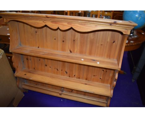 A modern yellow pine kitchen plate rack or shelf unit