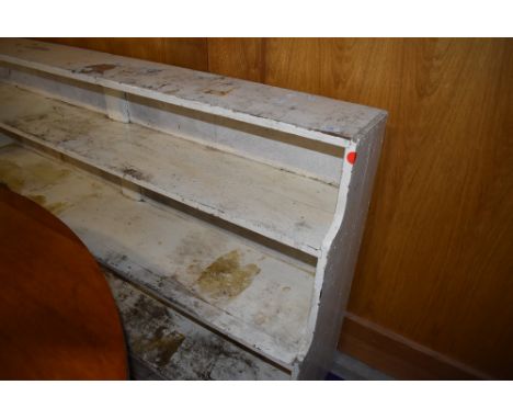 An early 20th century utility or storage shelf in painted pine ideal for stripping 6ft long