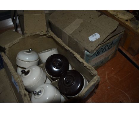 Three boxes of ceramic GEC switches.