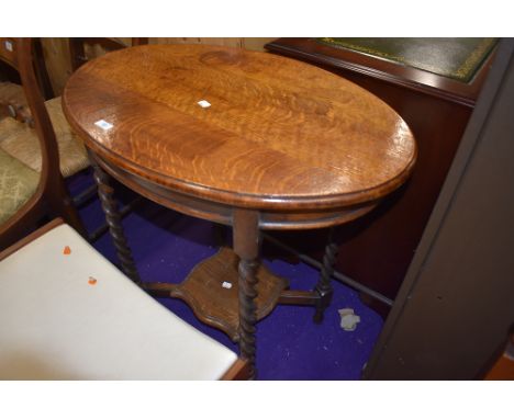 An Edwardian console or side table having barley twist oak legs and frame work